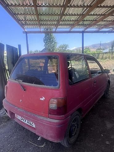 масла прес: Daihatsu Cuore: 1994 г., 0.8 л, Механика, Бензин, Купе — 3