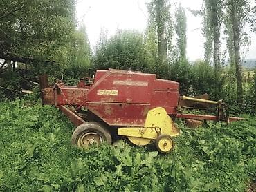 вакуумный компрессор: Пресс-подборщик New Holland модели 975, предназначенный для сбора и — 2