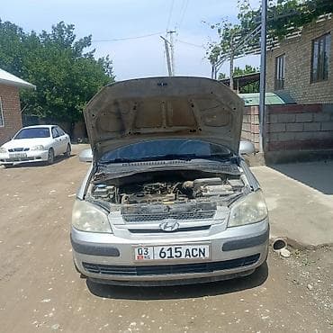 деу матиз 1: Компактный пятидверный хэтчбек серебристого цвета. Основные — 3