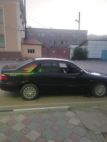 Унаа сатуу: Mazda 626: 1998 г., 2 л, Кол менен иштөөчү, Бензин, Седан — 3