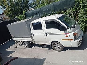 mini v: Hyundai Porter II, бортовой грузовик с тентом. Компактный — 2
