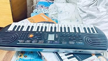 Спорт жана хобби: Синтезатор Casio SA‑77 (мини-клавиши) - 44 мини‑клавиши - Встроенный — 1