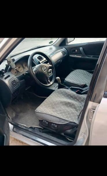 mx 5: Mazda 323: 2001 г., 1.6 л, Механика, Бензин, Хэтчбэк — 2