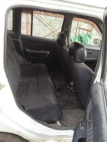mazda 3: Nissan Cube: 1997 г., 1.3 л, Автомат, Бензин, Минивэн — 4