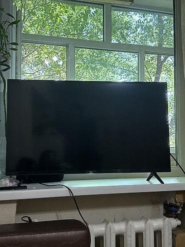 тв tcl: Телевизор TCL с плоским экраном, диагональ ориентировочно 40–43" — 1