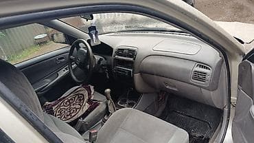 Транспорт: Mazda Capella: 2002 г., 1.8 л, Механика, Бензин, Универсал — 3
