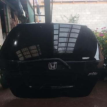 Крышка багажника (дверь пятой двери) для Honda Fit. - Оригинальная
