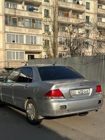 шипованные шины б у: Mitsubishi Lancer: 2006 г., 1.6 л, Автомат, Бензиновая, Седан — 4