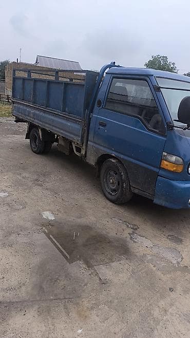 Унаа: Hyundai Porter — малотоннажный бортовой грузовик синего цвета — 1