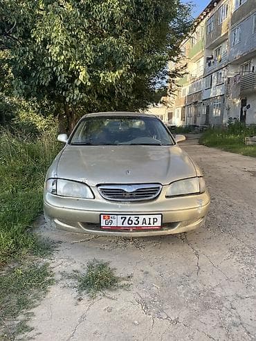 авто подборщик: Mazda 626: 1998 г., 2 л, Механика, Бензин, Седан — 3