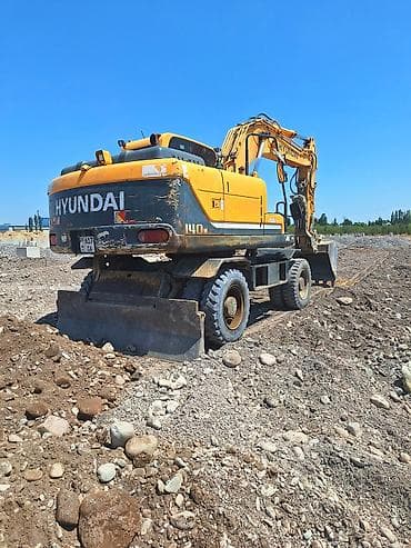 Услуги по строительству и ремонту: Услуги Колесный экскаватора Hyundai (серия R140W) догоговорная - — 3