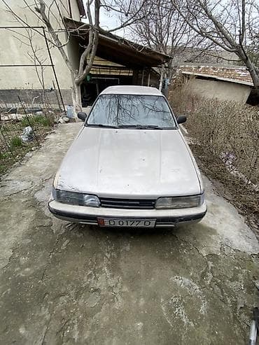 124 унверсал: Mazda 626: 1985 г., Седан — 4