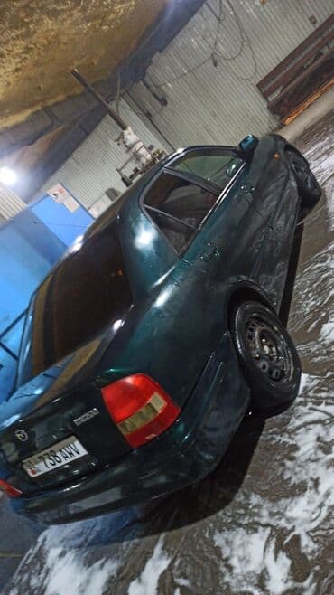 продаю или меняю на дом: Mazda 323: 2000 г., 1.6 л, Механика, Бензиновая, Седан — 13