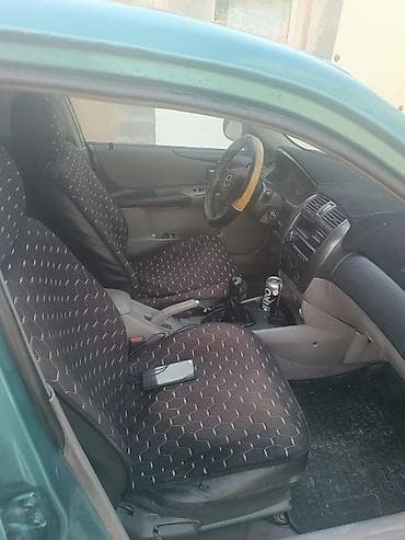 Mazda 323: 2003 г., 1.6 л, Кол менен иштөөчү, Хетчбек — 1