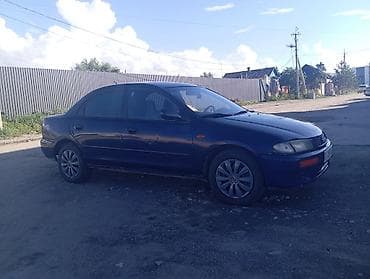 lx 470 2007: Mazda 323: 1996 г., 1.5 л, Механика, Бензин, Седан — 4