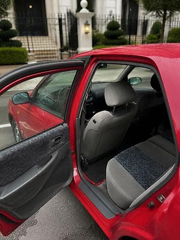 авто мотор: Mazda 323: 1998 г., Хэтчбэк — 5