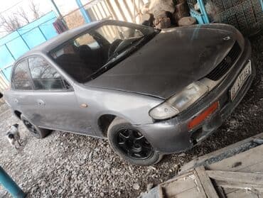 дайво мубира: Mazda 323: 1995 г., 1.5 л, Механика, Бензин, Седан — 5