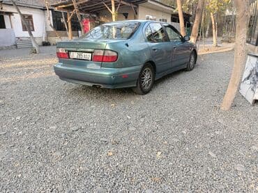 значок на авто: Nissan Primera: 2000 г., 2 л, Автомат, Бензиновая, Седан — 6