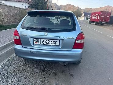 Транспорт: Mazda 323: 2001 г., 1.6 л, Механика, Бензин, Универсал — 5