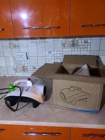 Дым-машина (генератор тумана) компактного форм‑фактора, с ручкой для