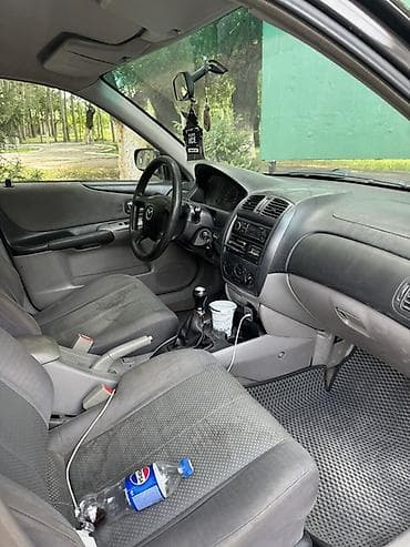 вампер 124: Mazda 323: 2001 г., 1.6 л, Механика, Бензин, Универсал — 4