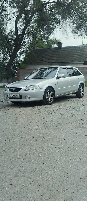 Транспорт: Mazda Familia: 2001 г., Кол менен иштөөчү, Газ, Универсал — 2