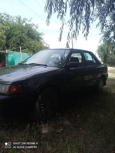 gac s9: Mazda 323: 1990 г., Механика, Бензин, Седан — 4