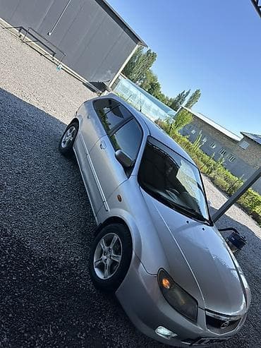 yamaha n max: Mazda 323: 2003 г., 1.6 л, Механика, Бензин, Хэтчбэк — 2