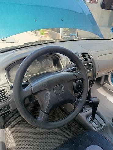 каропка на мазда: Mazda 323: 1999 г., 1.5 л, Автомат, Бензин, Универсал — 9