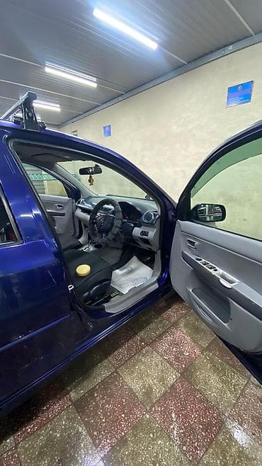 шины демио: Mazda Demio: 2003 г., 1.5 л, Автомат, Газ, Седан — 6