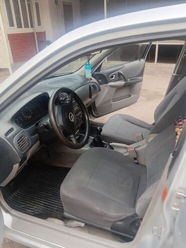автомобиль бу: Mazda 323: 2003 г., 1.3 л, Механика, Бензин, Хетчбек — 9