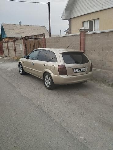e2 byd: Mazda 323: 2002 г., 1.6 л, Механика, Бензин, Хэтчбэк — 2