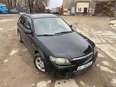 Mazda 323: 2003 г., Механика, Бензин, Универсал