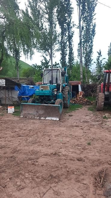 каток траншейный: Фронтальный погрузчик на трактор с задним экскаваторным оборудованием — 1