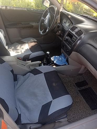 домкрат на фит: Mazda Familia: 2002 г., 1.6 л, Механика, Бензин, Универсал — 4