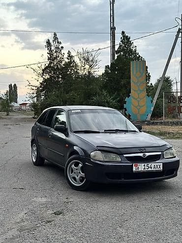 хонда истеп 1: Mazda 323: 1999 г., 1.5 л, Кол менен иштөөчү, Бензин, Хетчбек — 1