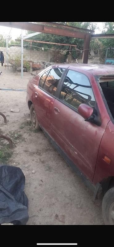 aion v plus: Nissan Almera (седан), красный цвет, кузов P11. Описание: - — 3