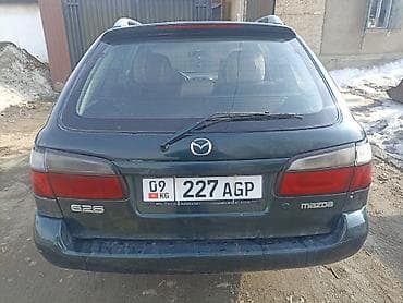 заглушка диска: Mazda Capella: 1998 г., 1.8 л, Механика, Бензин, Универсал — 7