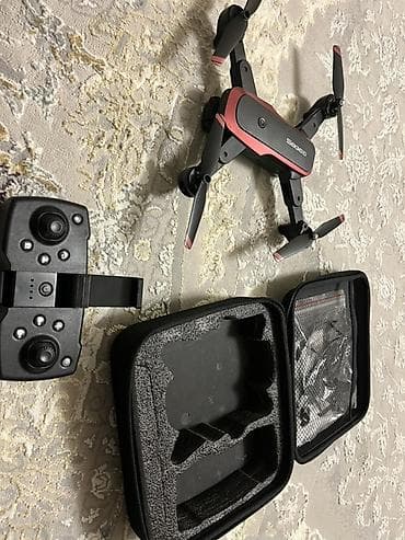 Складной квадрокоптер с камерой и комплектом аксессуаров. Основные