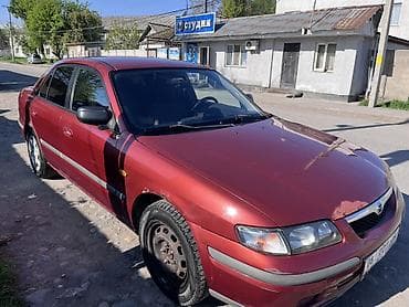 ун басандаткыч: Mazda 626: 1998 г., 1.8 л, Кол менен иштөөчү, Бензин, Седан — 5
