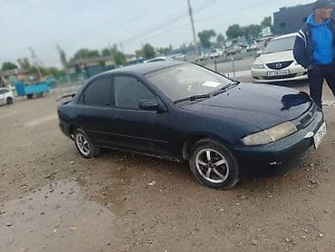 Mazda 323: 1997 г., Седан