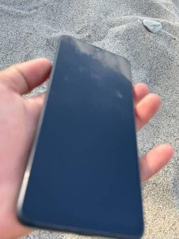 плазма тв: Смартфон Redmi черного цвета с глянцевой задней панелью. Оснащен — 2