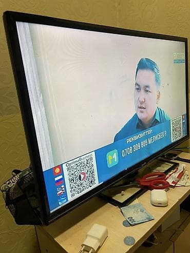 a 32: Телевизор, диагональ 32" (примерно 80 см). Плоская LED‑панель, черная — 1