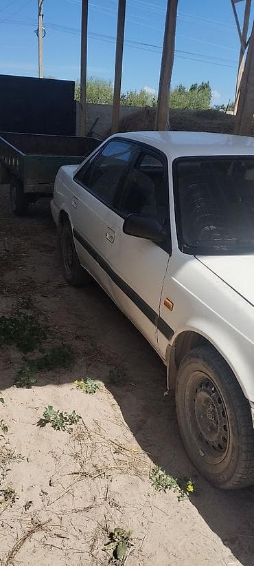 Транспорт: Mazda 626: 1991 г., 2 л, Механика, Бензин, Седан — 4
