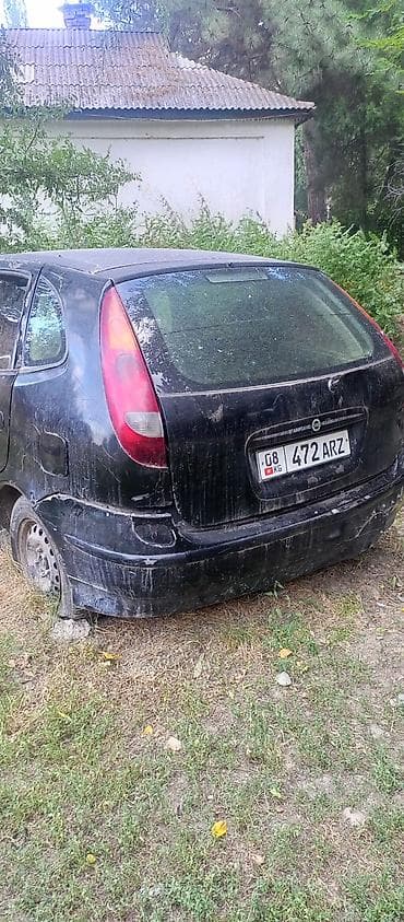 185 14: Nissan Almera Tino: 2002 г. — 1