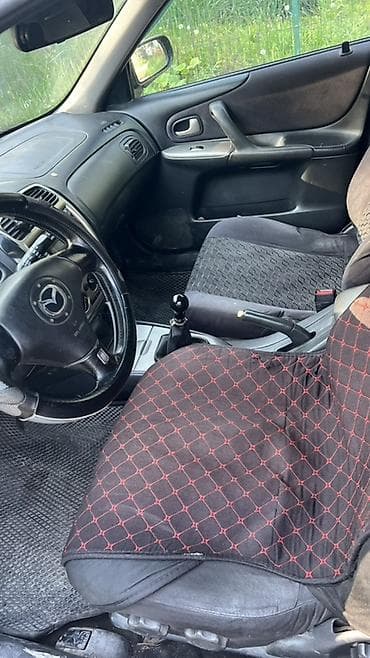 mini copper: Mazda 323: 2001 г., Универсал — 5