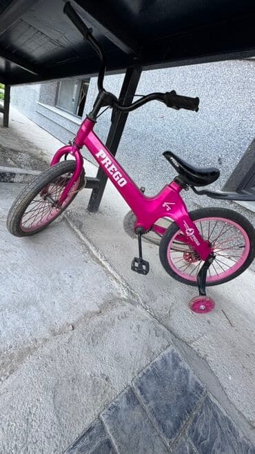 крылья для велосипеда: Яркий детский велосипед Prego, выполненный в насыщенном розовом цвете — 1