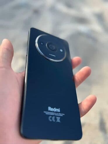 плазма тв: Смартфон Redmi черного цвета с глянцевой задней панелью. Оснащен — 4
