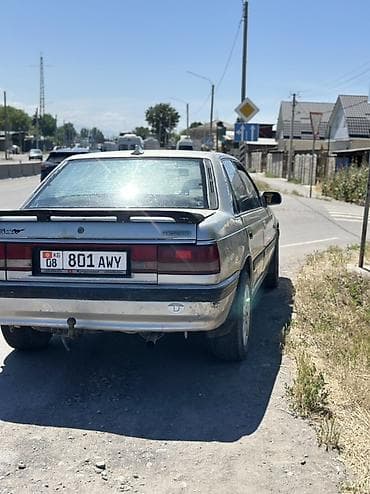 210 mers: Mazda 626: 1988 г., 2.2 л, Механика, Бензин, Седан — 6