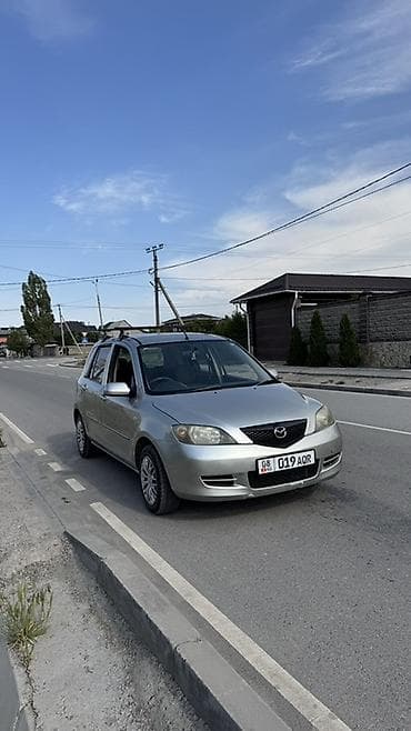 Mazda Demio: 2004 г., 1.5 л, Автомат, Бензин, Хэтчбэк — 2